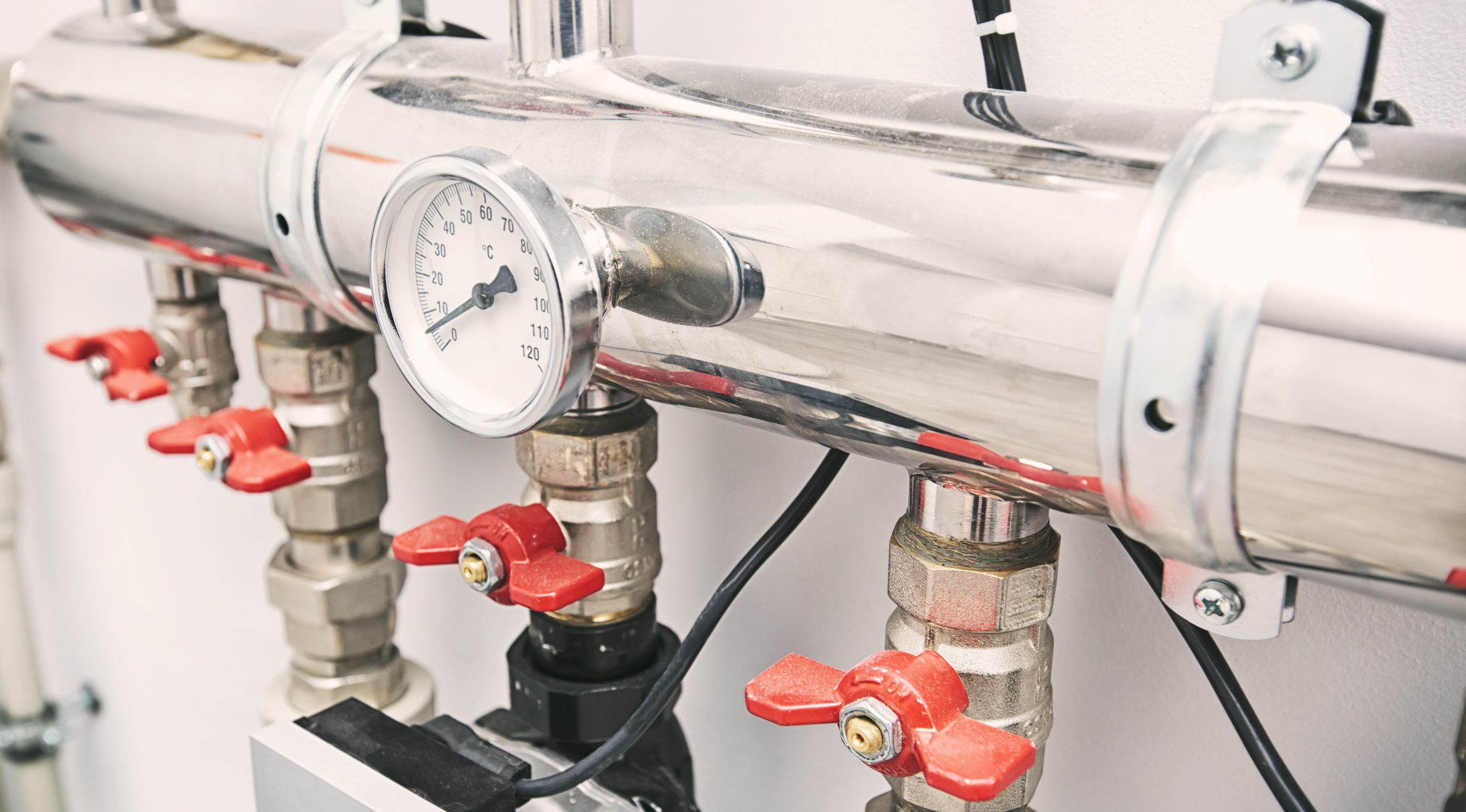 A lot of different faucets and other equipment for boiling room